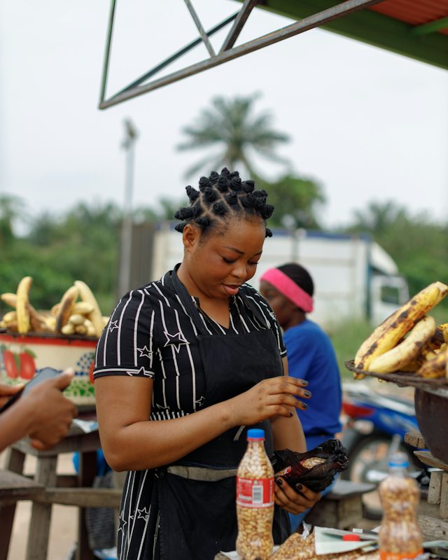 Boli and groundnut seller at Benin City